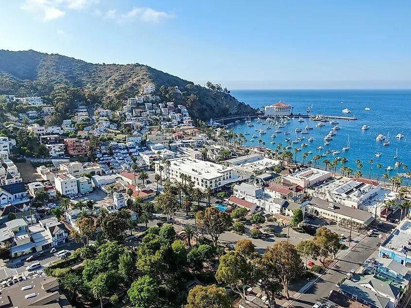 The round Casino building on the Avalon waterfront, with moored boats in the foreground