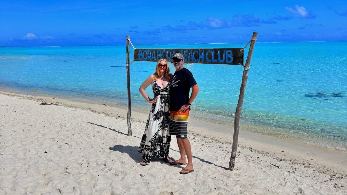 Some Tuesday on a mooring in the Bora Bora lagoon, with overwater bungalows and the island peak behind