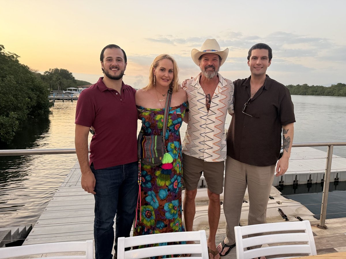 On the marina dock at sunset. Left to right: Gabe, First Mate Meg, Captain Steve and Herbert.