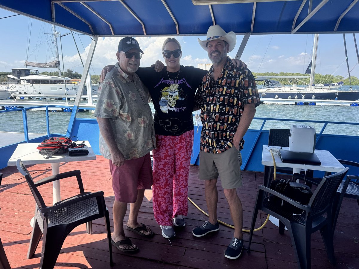 Bill, First Mate Meg, and Captain Steve on deck at the marina, left to right