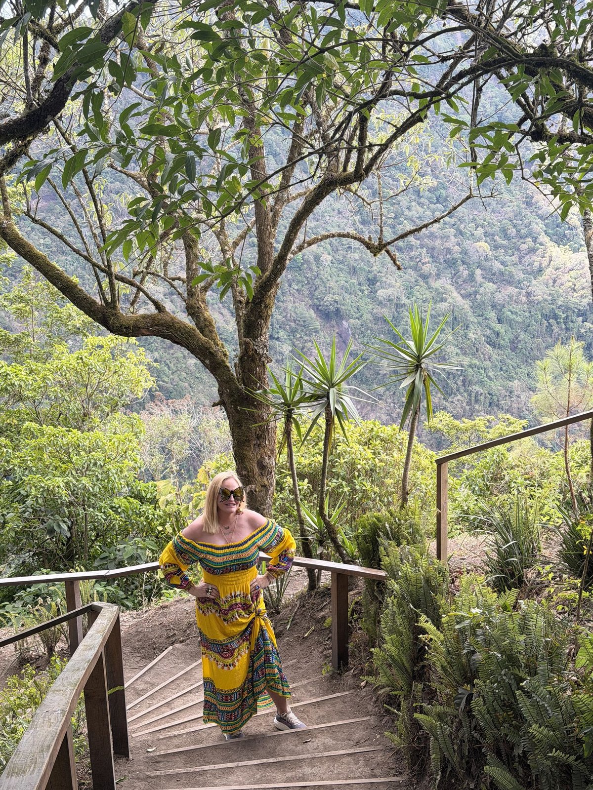 First Mate Meg on the trail at Mirador 1, El Boquerón, with the crater rim of San Salvador Volcano behind her