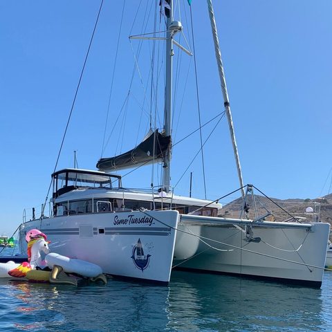 Some Tuesday at anchor with a unicorn float tied alongside