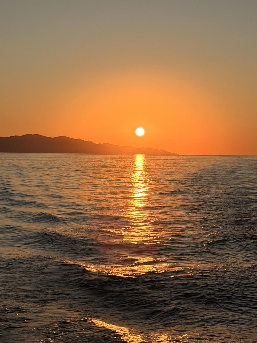 Sunset over the Sea of Cortez, with a rocky island in silhouette