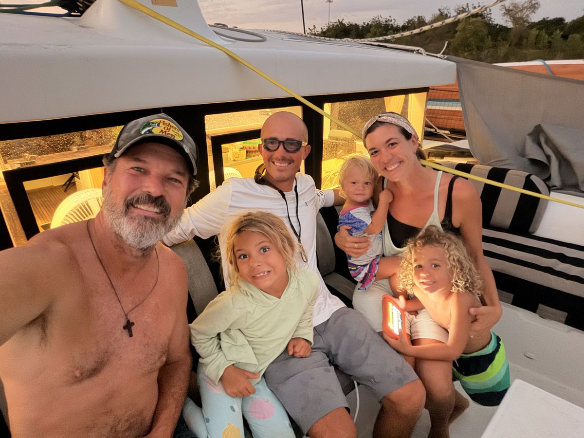 Dave and Dani of Sea Again with their kids on a dock