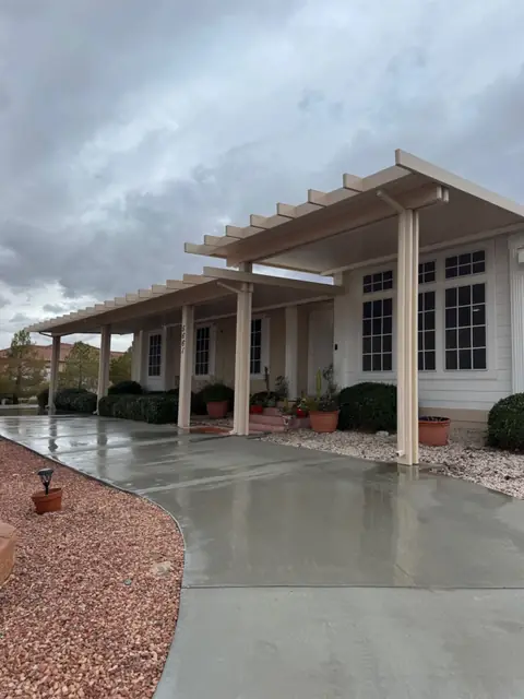 Long covered patio running along the front of the house