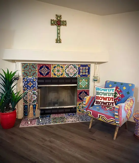 Wood-burning fireplace framed in hand-painted Talavera tile