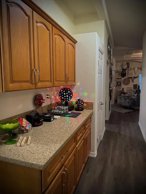 Hallway counter and cabinetry leading through to the bedrooms
