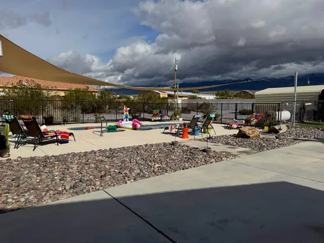 Striped loungers and towels on the wide pool deck