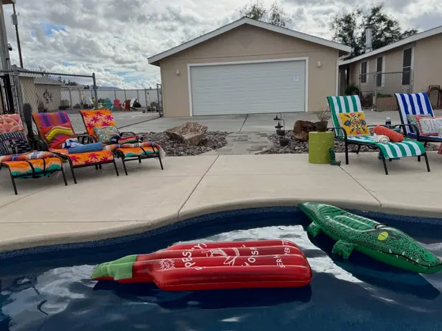 Colourful patio furniture ringing the pool deck